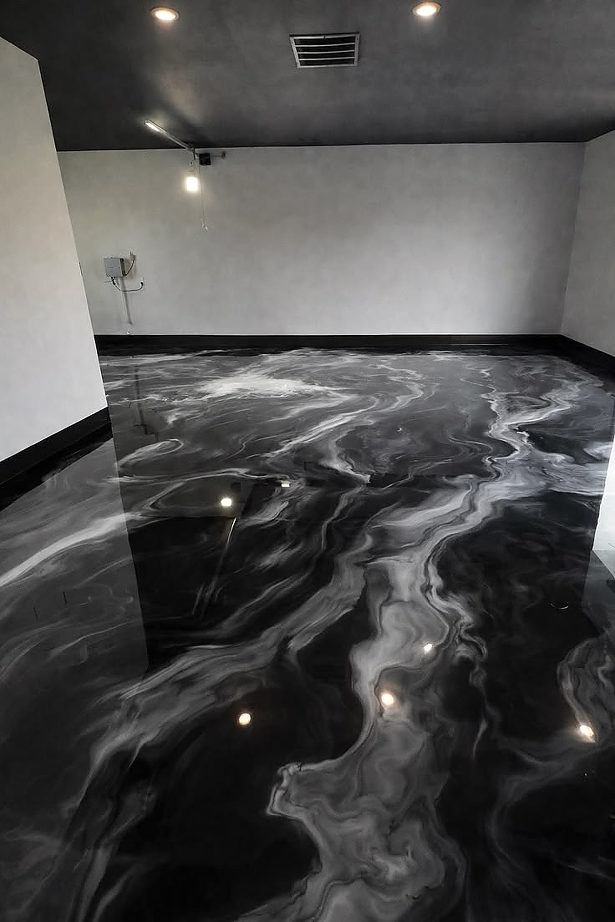 Black and silver metallic epoxy floor close up
