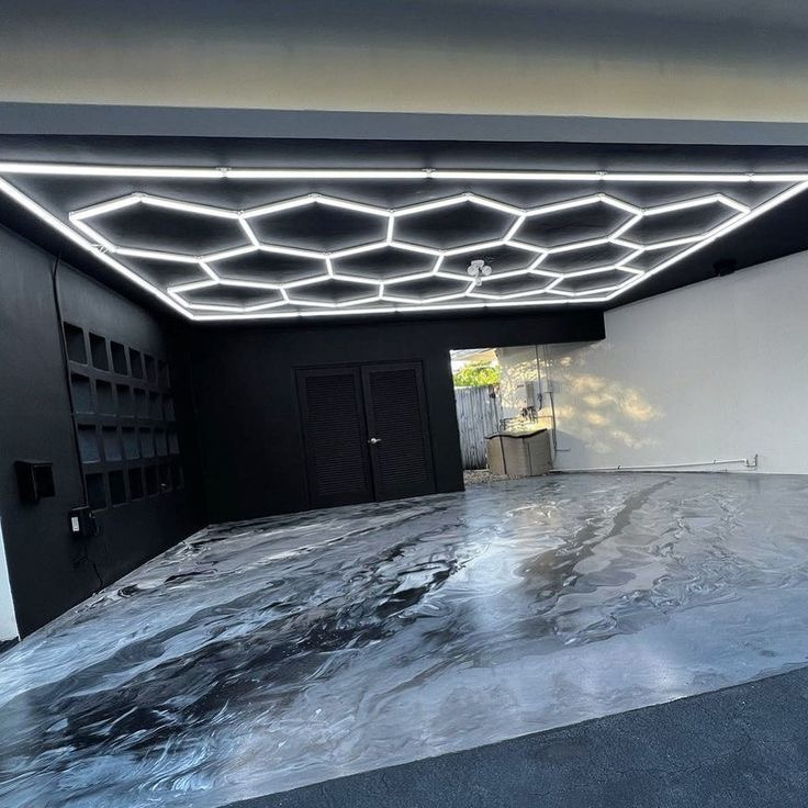 Gray and white marble metallic garage floor with hex lights