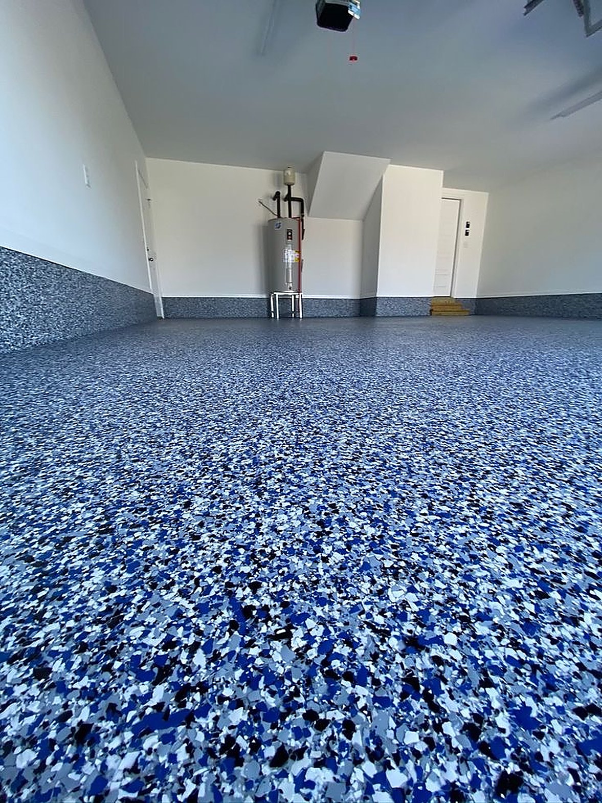 Blue, black and white flake epoxy garage floor