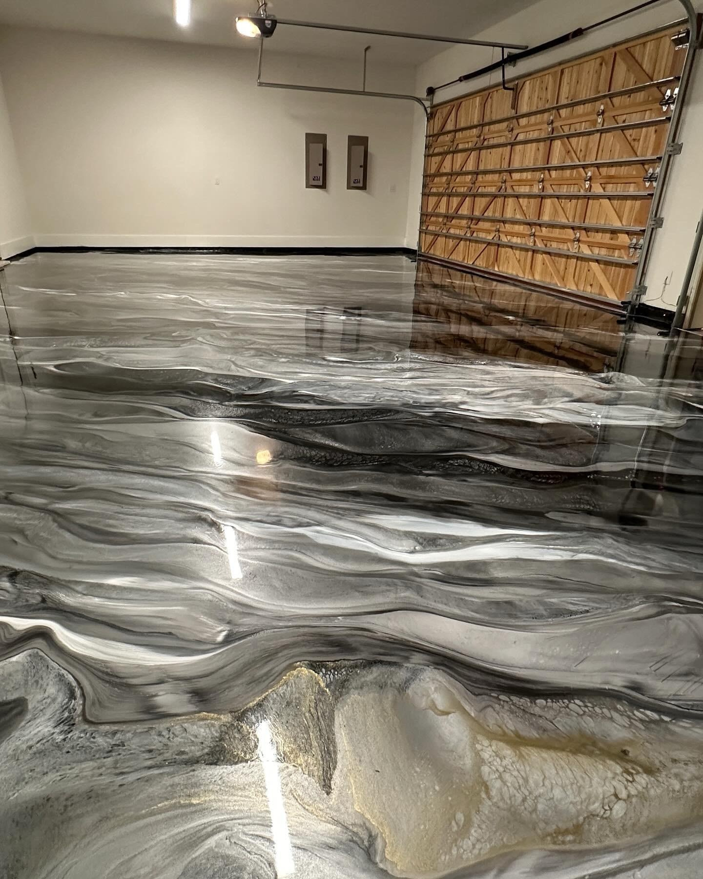 Gray metallic epoxy garage floor with wood door
